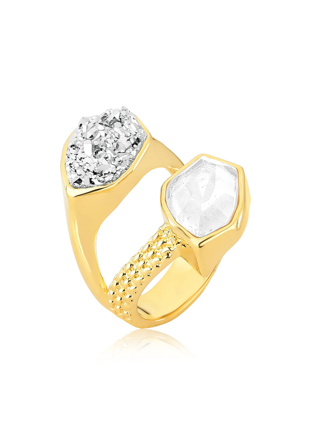 Gold ring with a diamond and clear stone on a white background