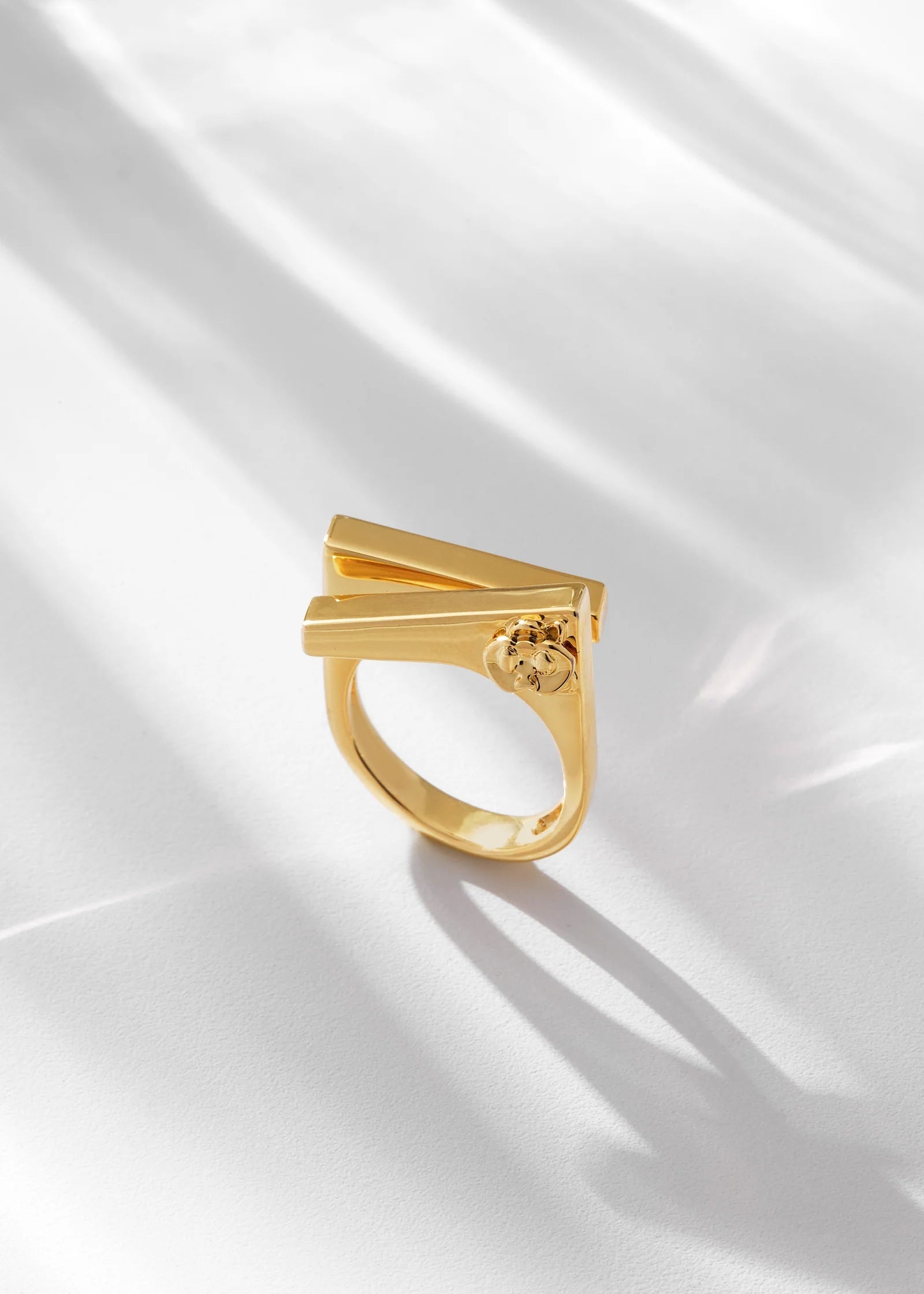 Gold ring on a white fabric background