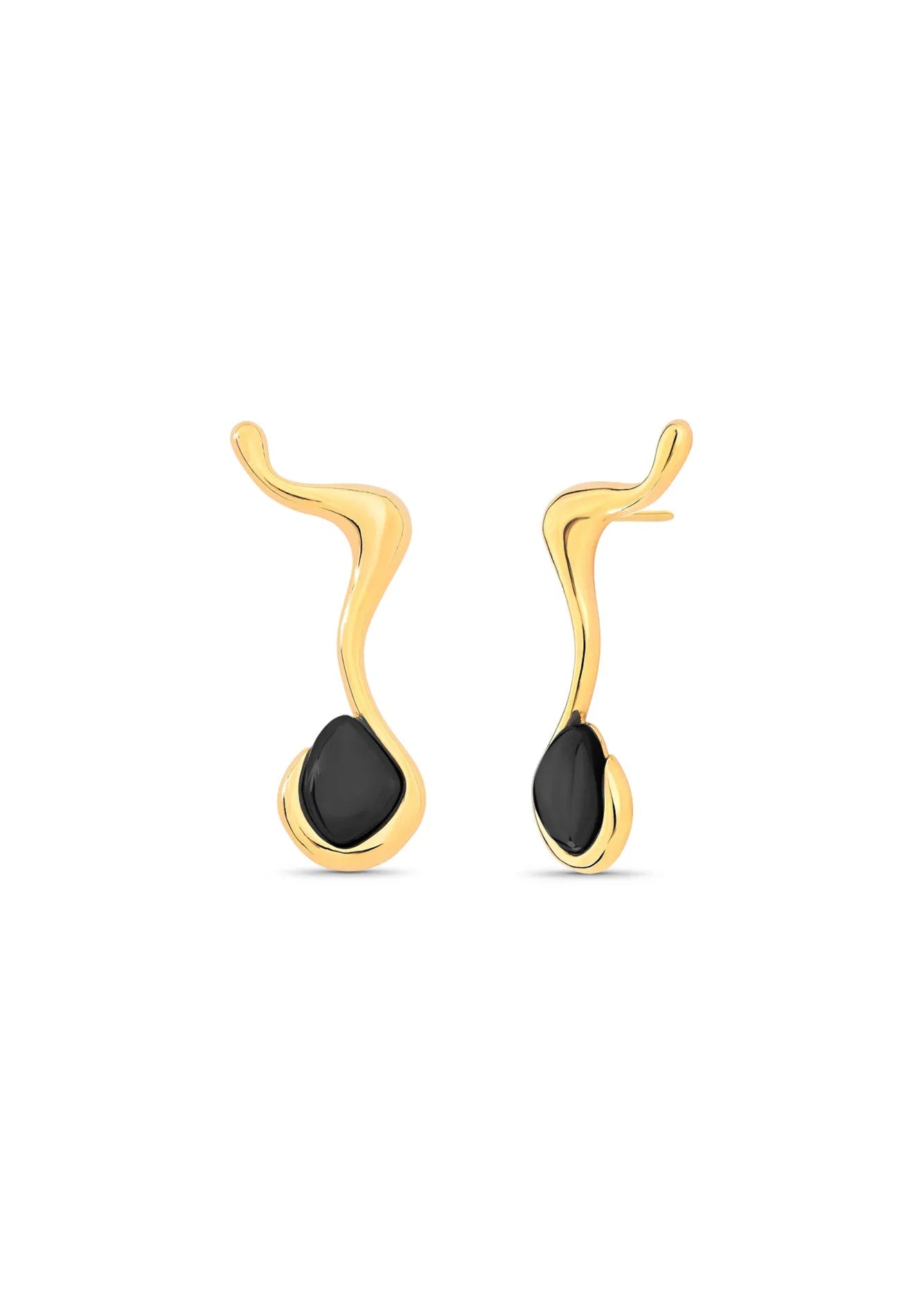 A pair of gold earrings with an abstract, wavy design and a smooth black teardrop-shaped stone set in the center, shown against a plain white background.