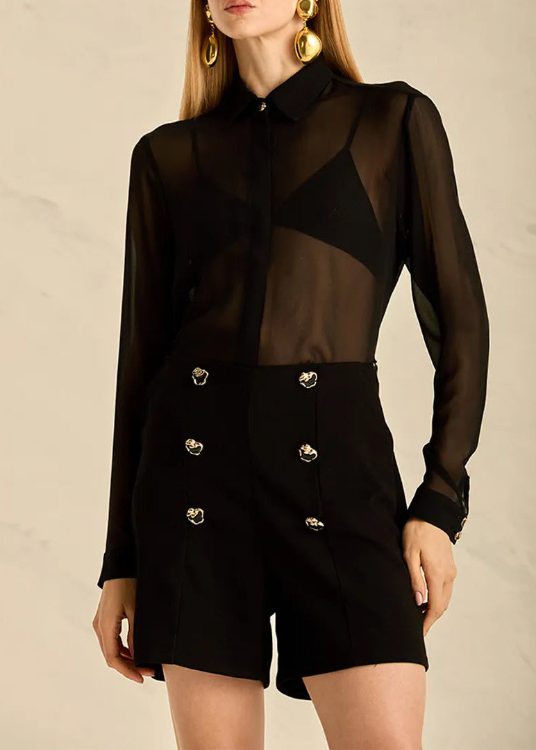 black shorts with golden buttons