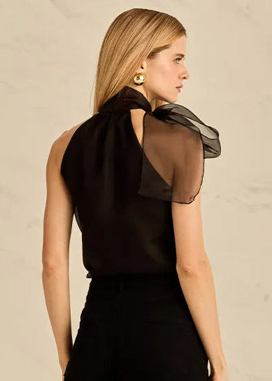 Woman wearing a black silk blouse