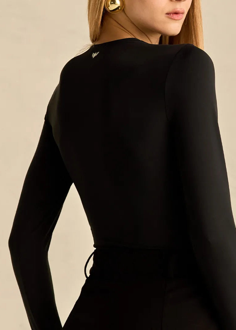 Person wearing a black long-sleeve top