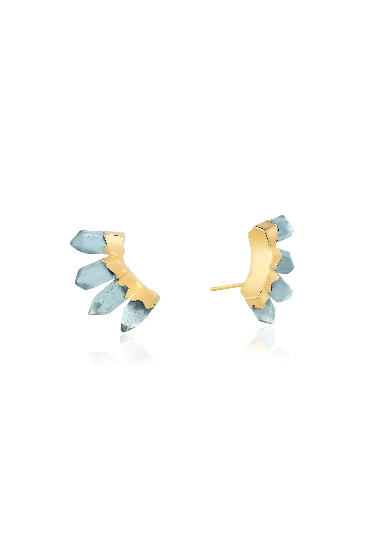 Gold and blue earrings on a white background