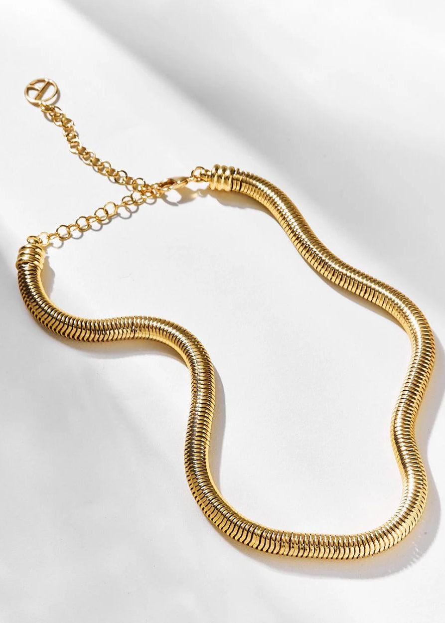 Gold necklace on a white background