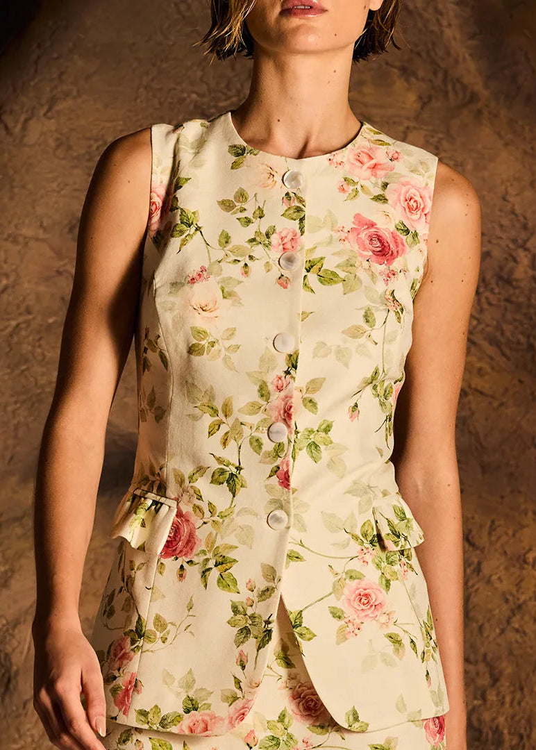 Woman wearing a floral dress against a textured brown background