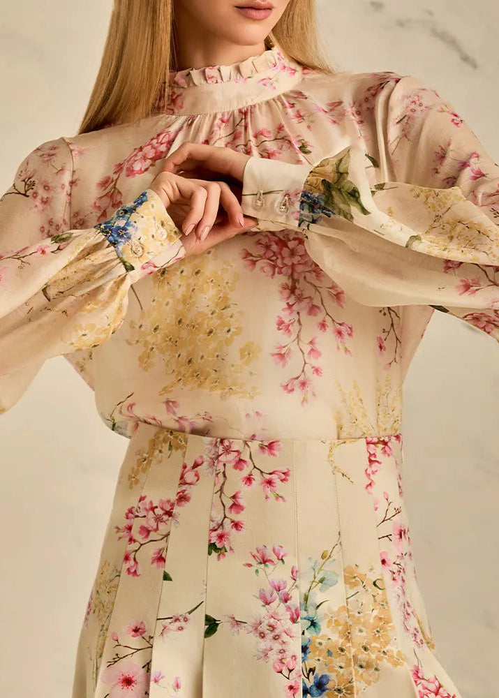 Floral blouse with long sleeves and a soft background
