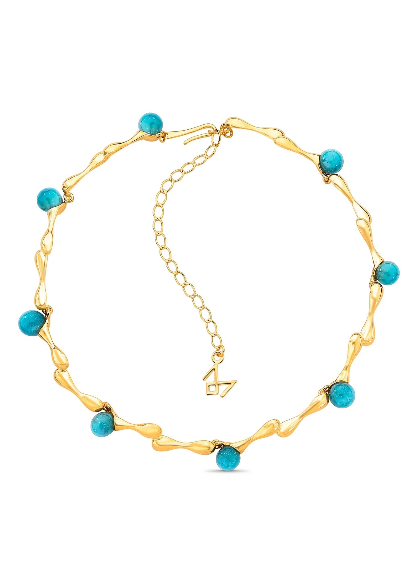 Gold necklace with turquoise beads on a white background