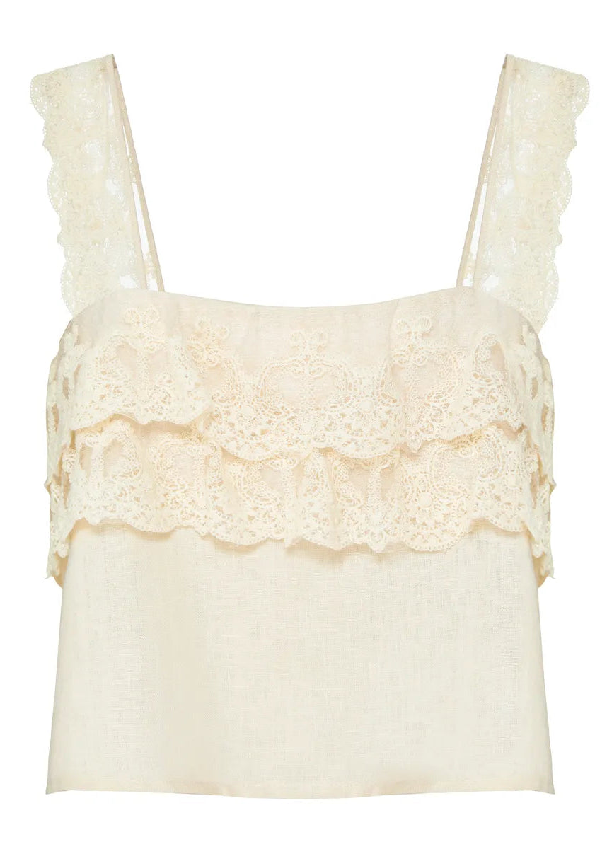 Cream-colored lace top on a white background