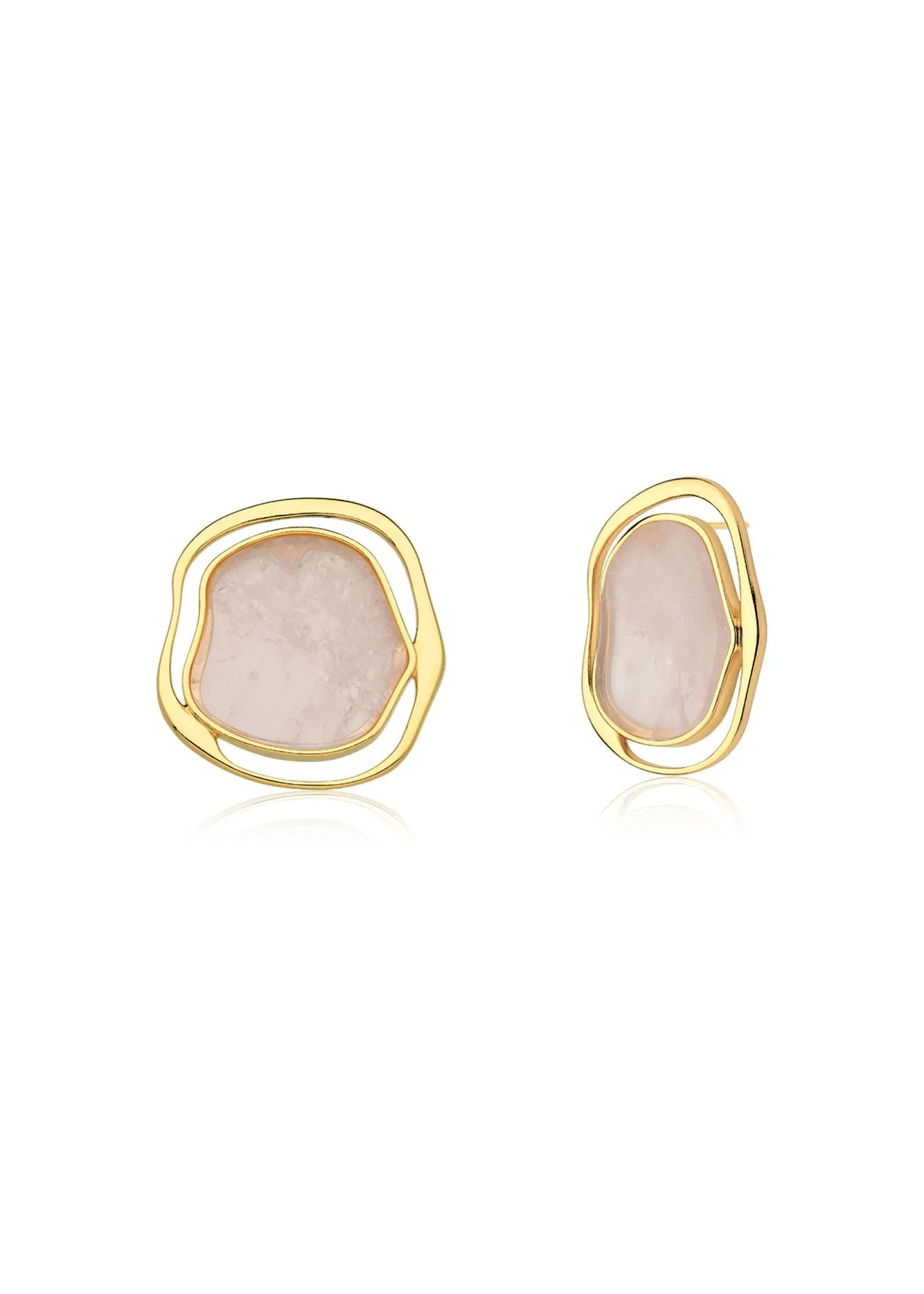 Pair of gold earrings with pink stone centers on a white background
