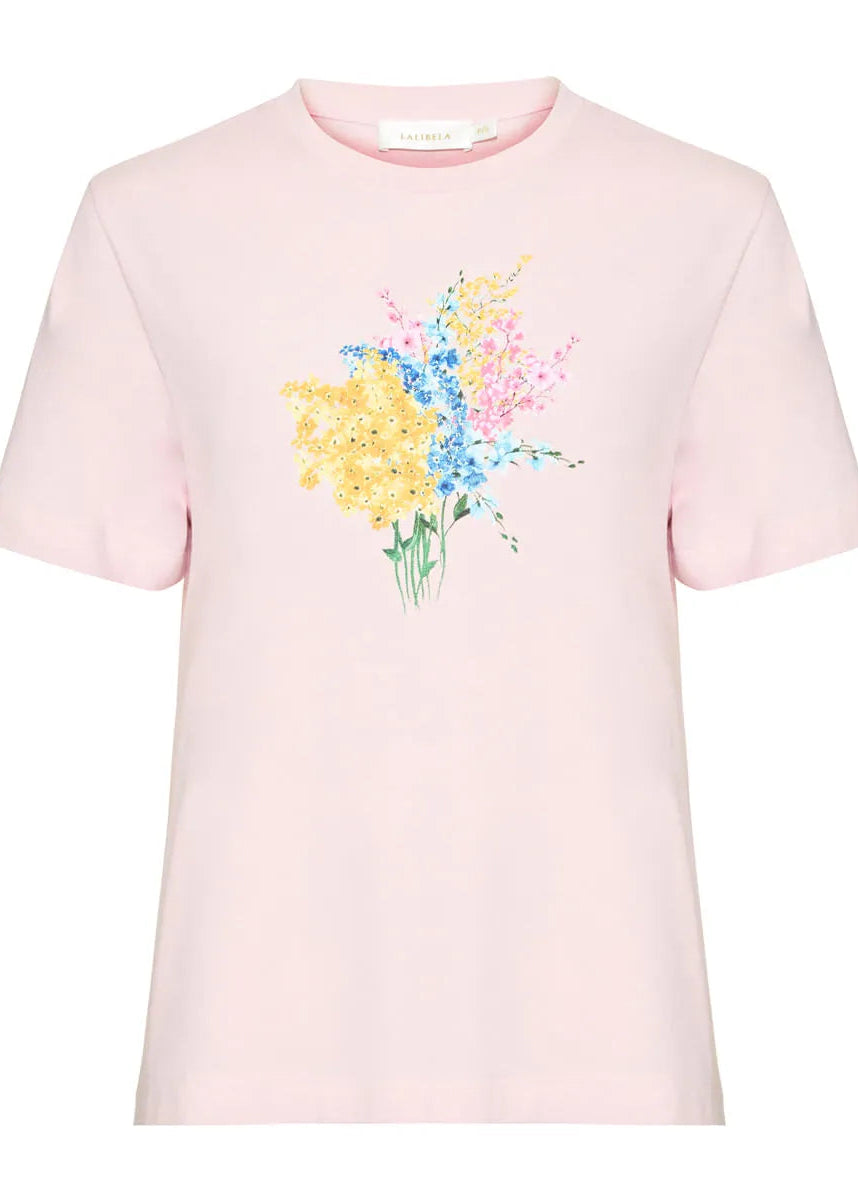 Pink t-shirt with a colorful floral design on a white background