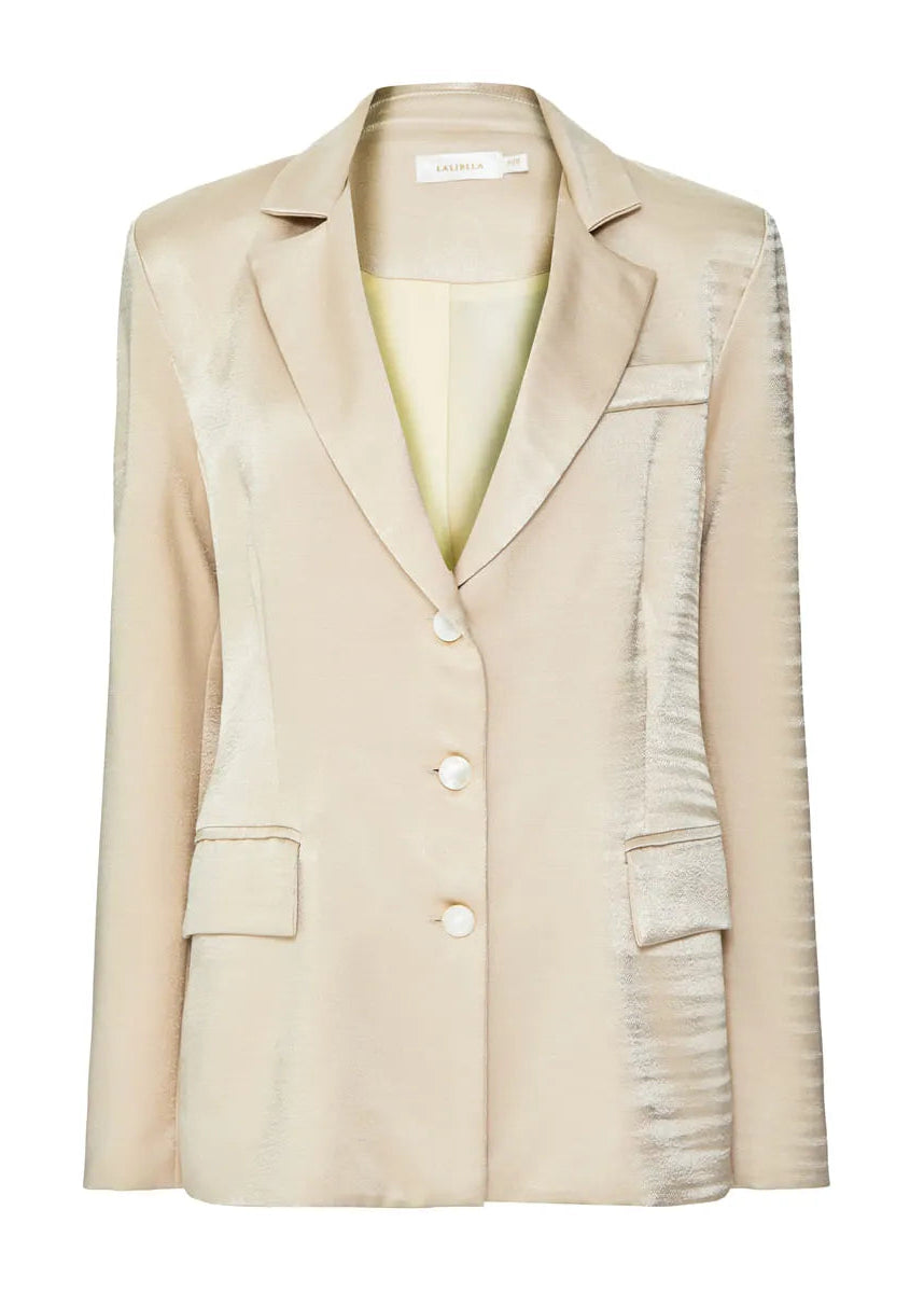 Beige blazer with a white background