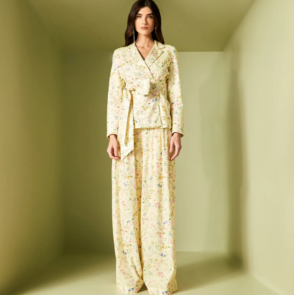 Woman wearing a floral outfit in a minimalistic setting