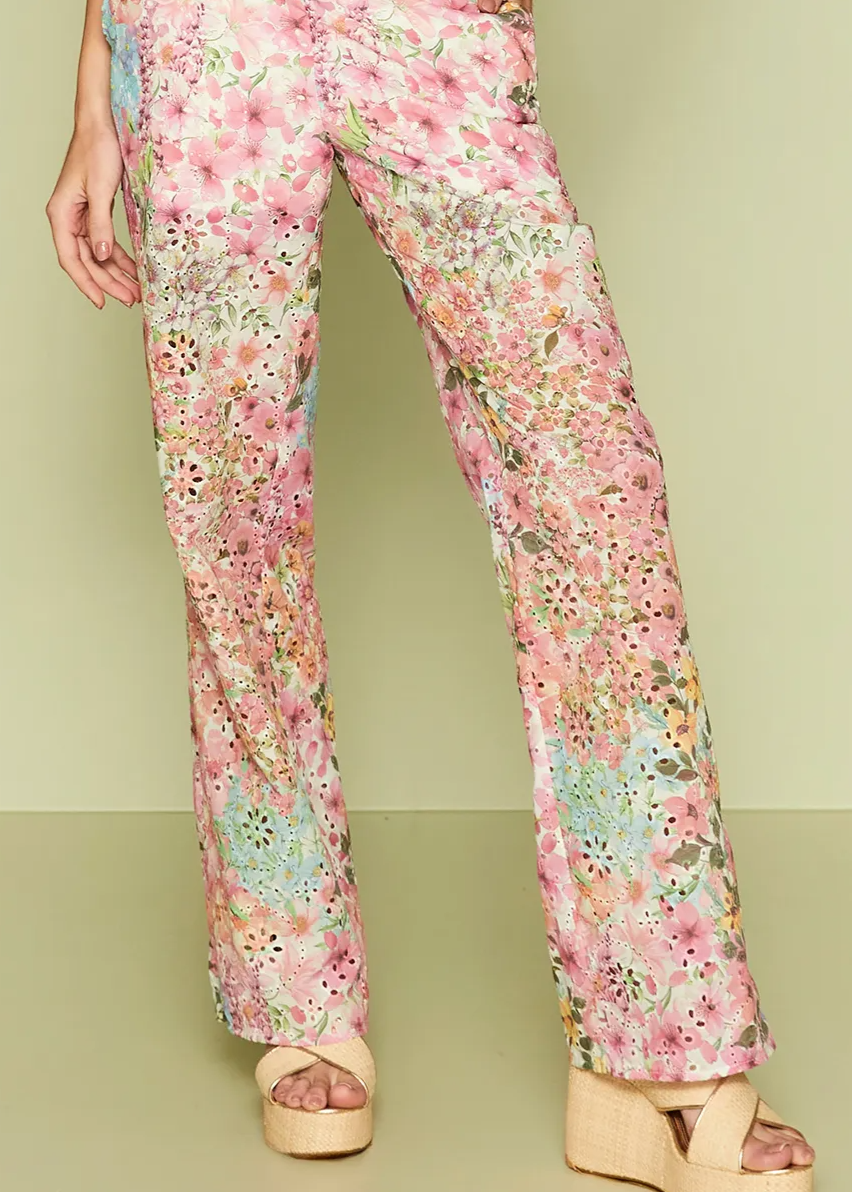 Floral patterned pants on a plain background