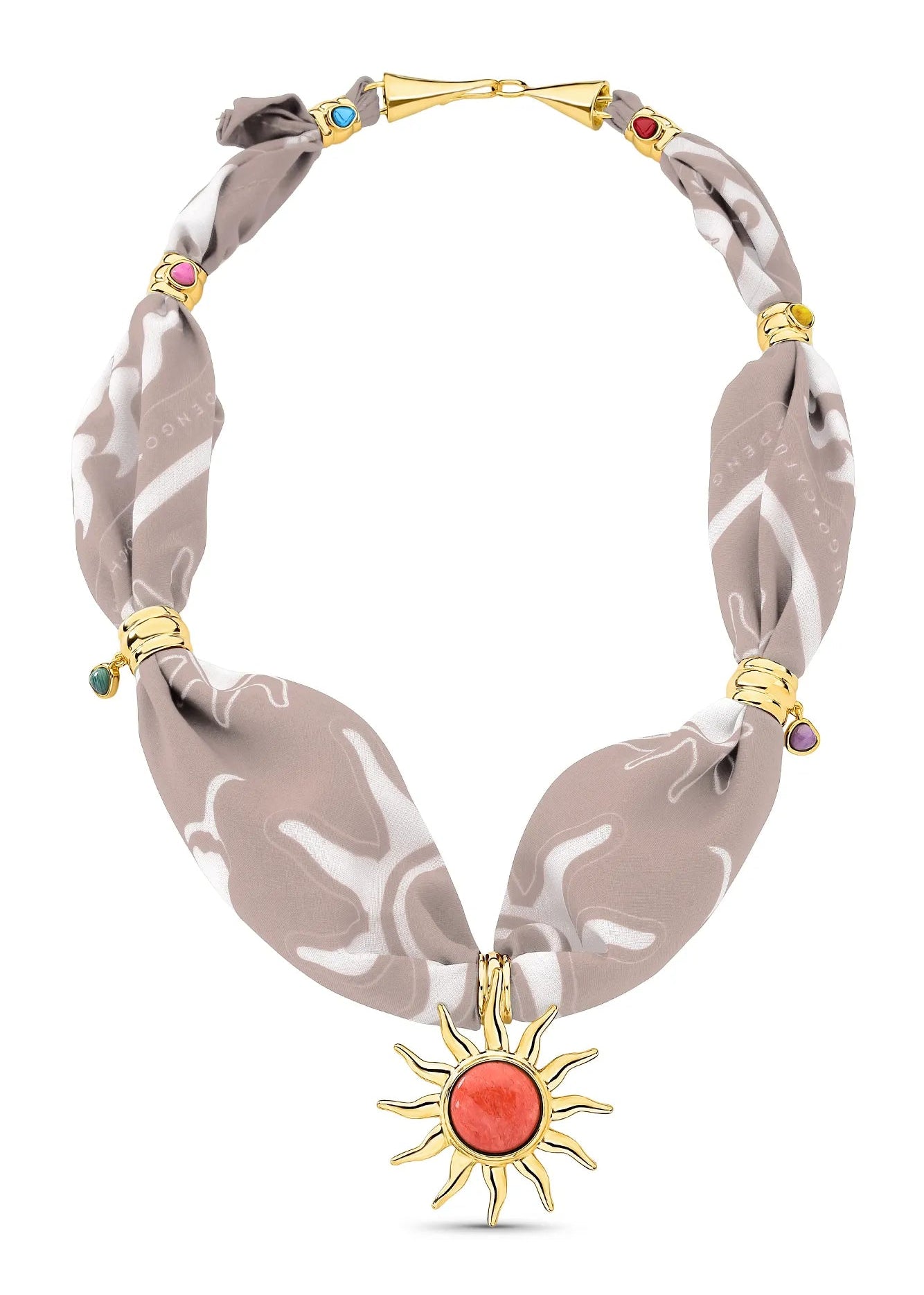 Necklace with sun pendant and patterned fabric strap on a white background
