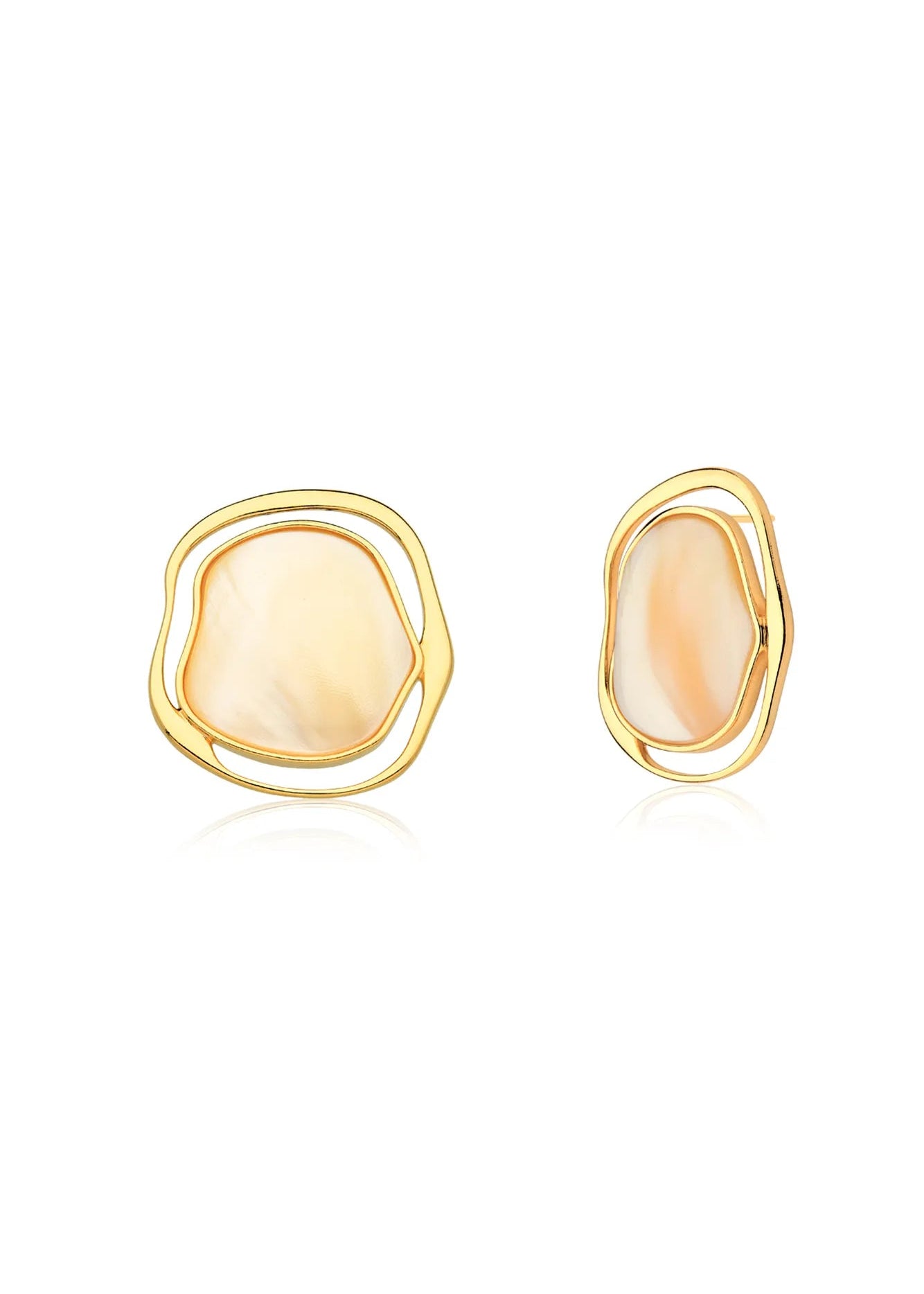 Gold earrings with a light stone on a white background