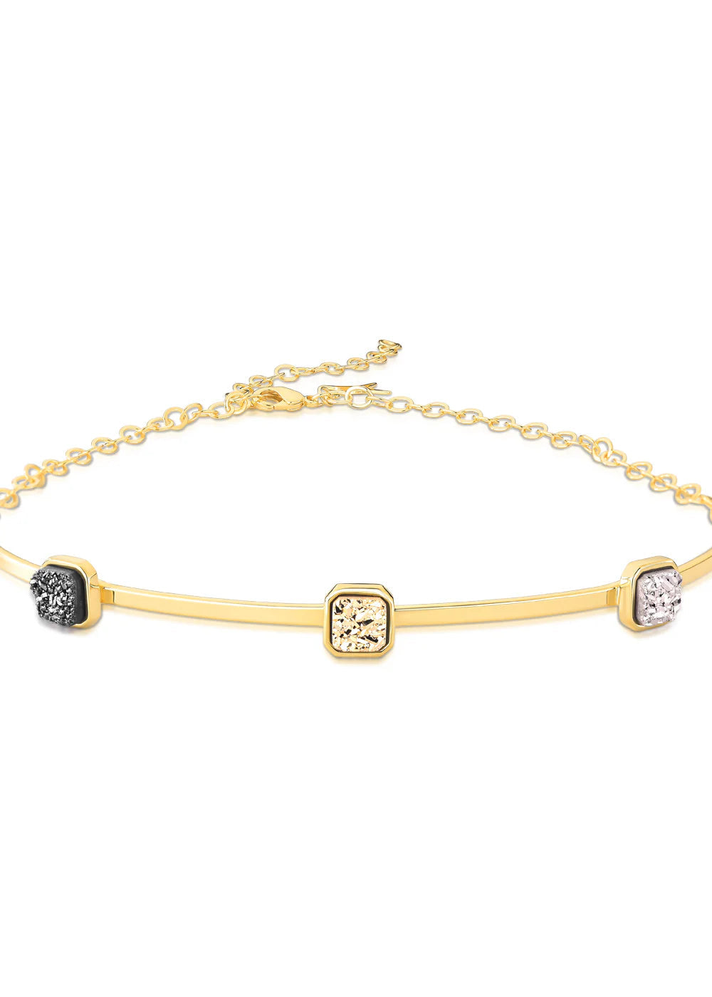 Gold bracelet with embedded stones on a white background
