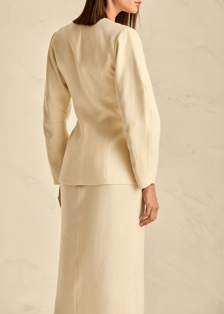 Woman wearing a beige suit