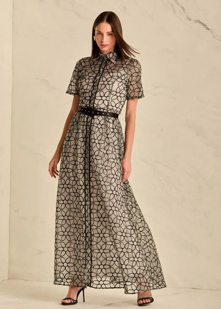 Woman wearing a black and white patterned dress