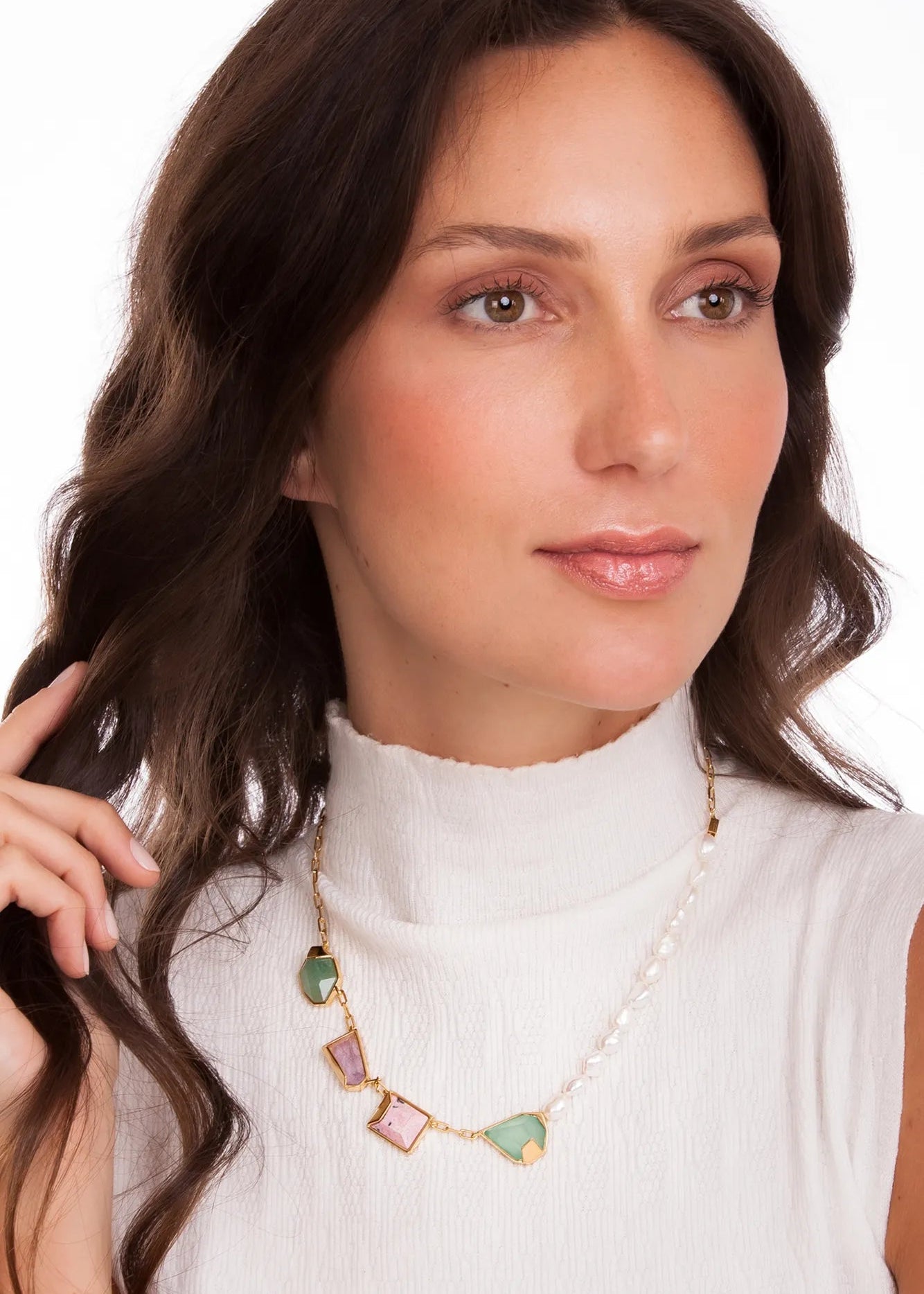 Woman wearing a necklace with a white background