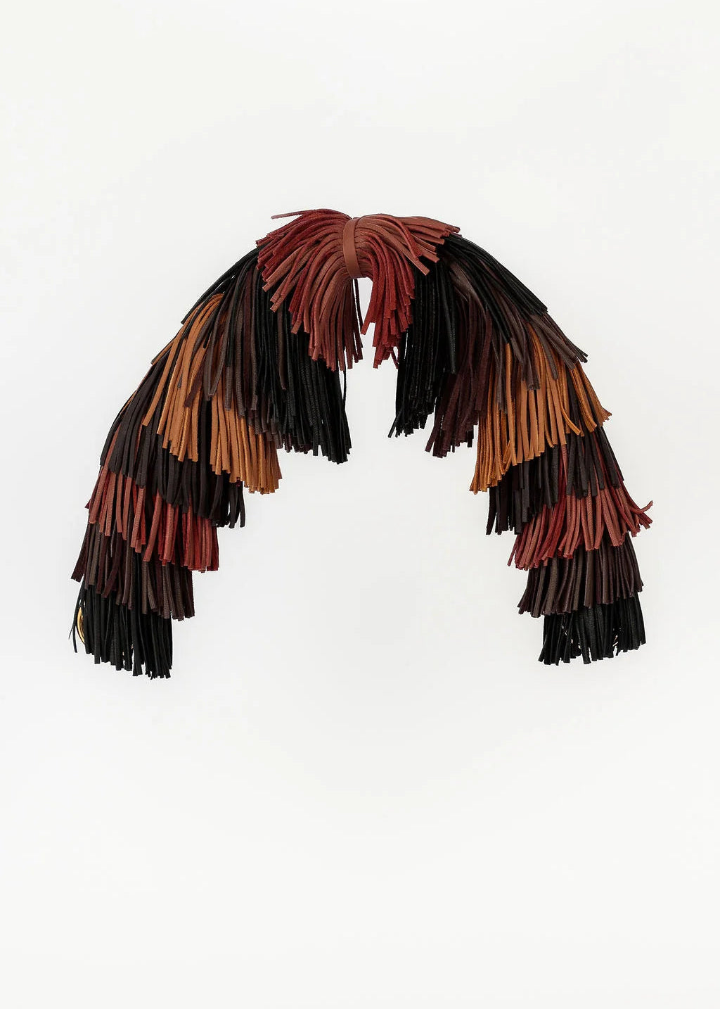 Multicolored feathered headpiece on a white background