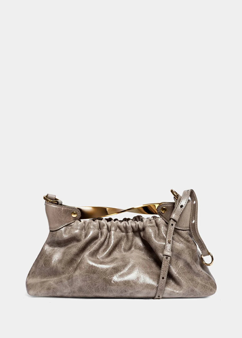 Metallic handbag on a light gray background