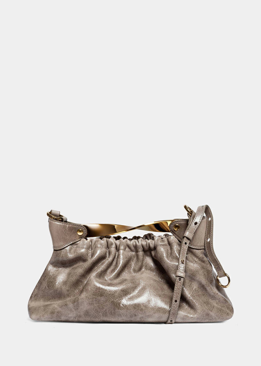Metallic handbag on a light gray background