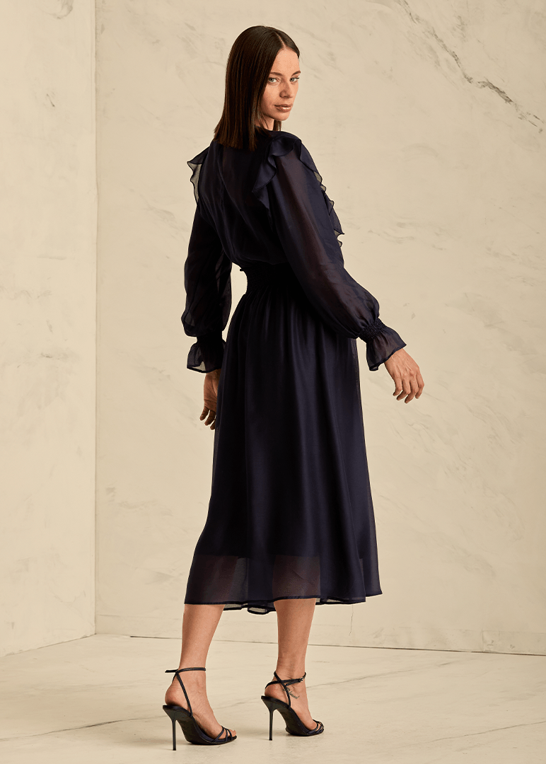 Woman wearing a navy blue dress