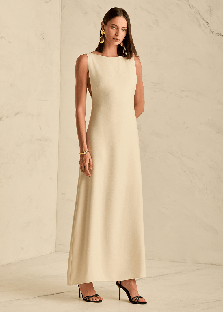 Woman wearing a long beige dress