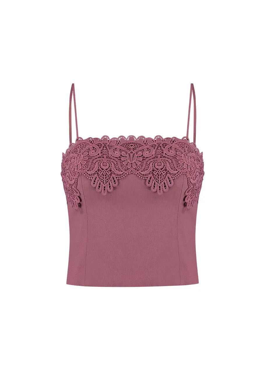 Pink lace-trimmed top on a white background