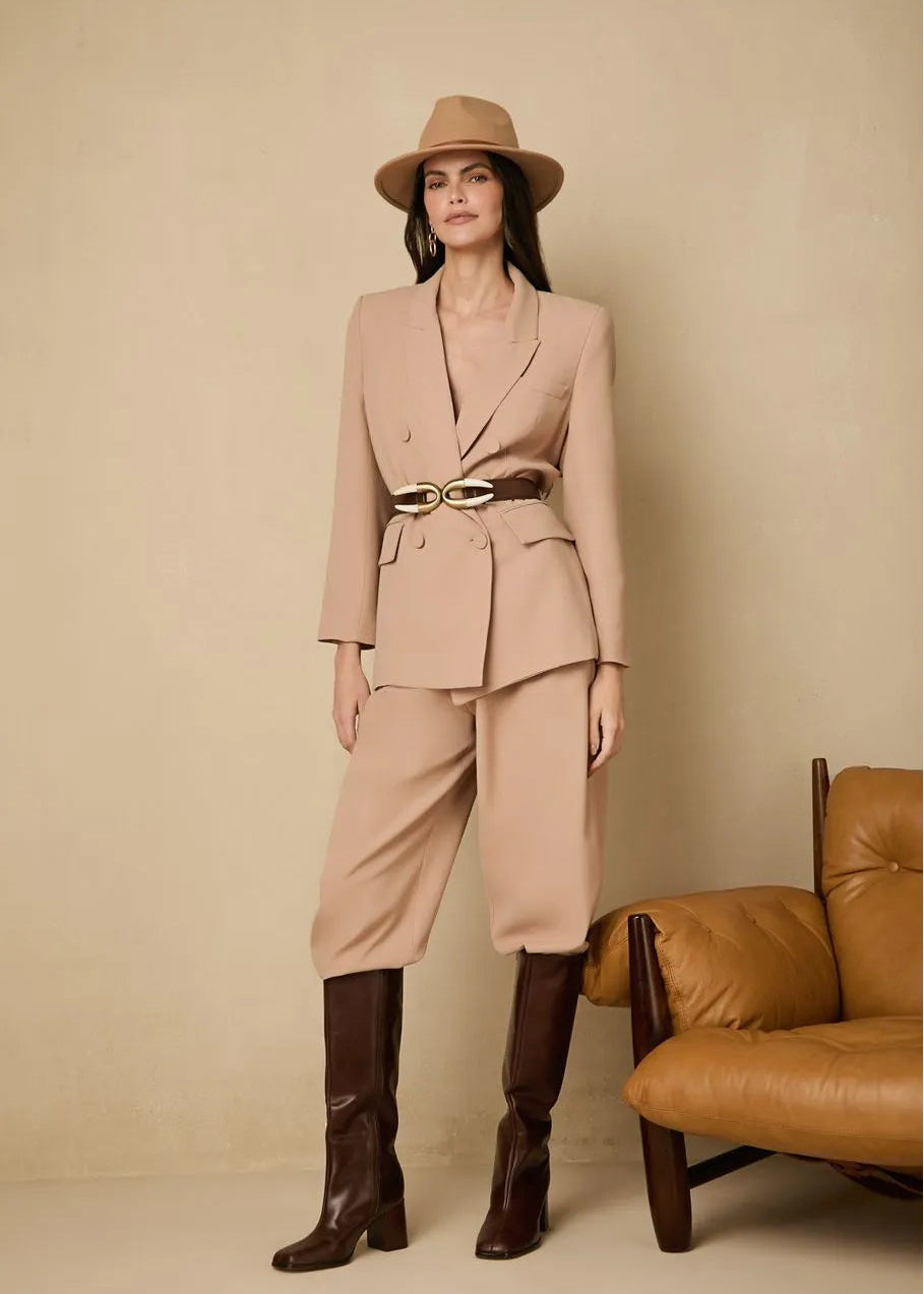 woman using a sand color blazer with rounded buttons
