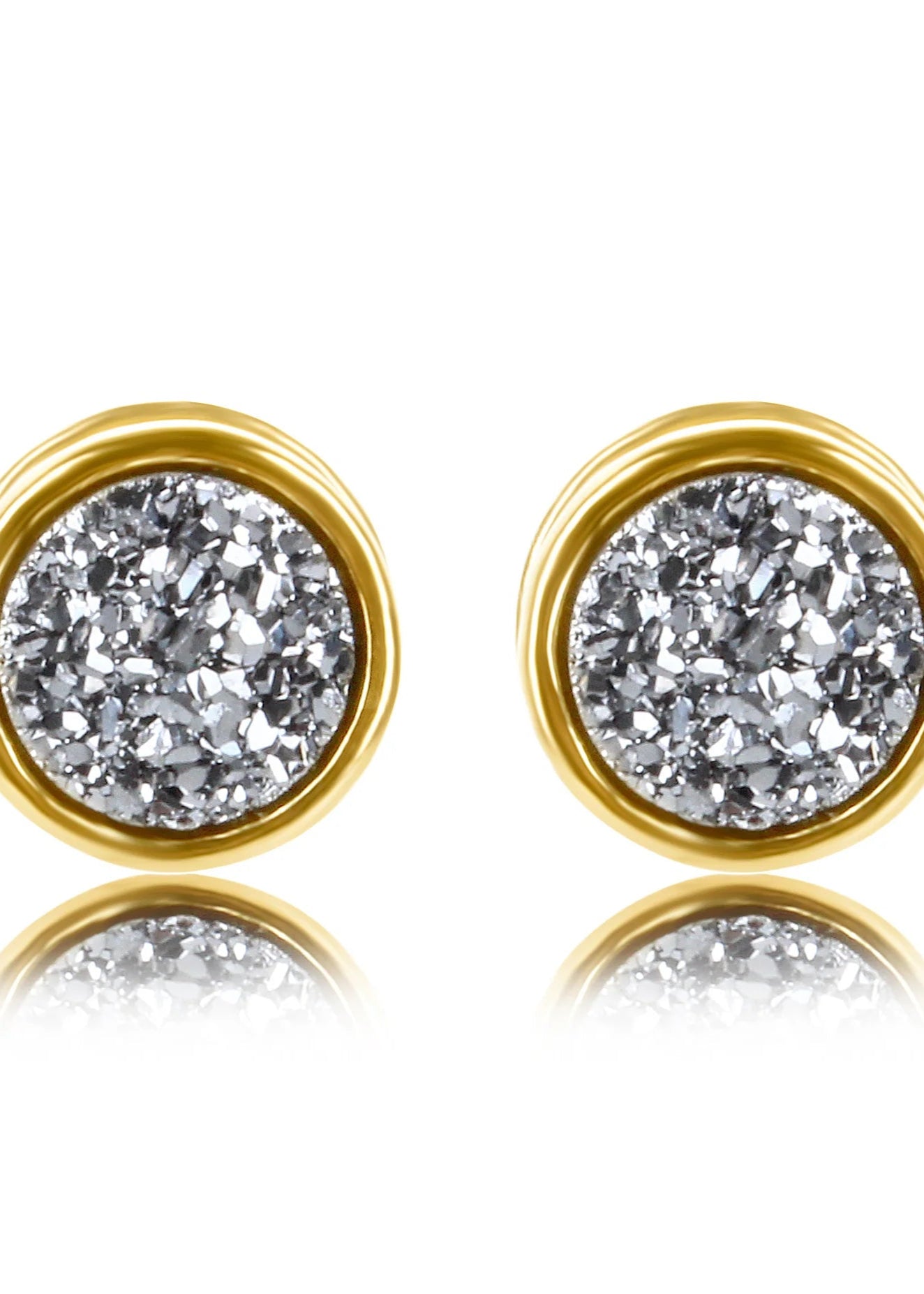 Gold-framed diamond stud earrings on a white background
