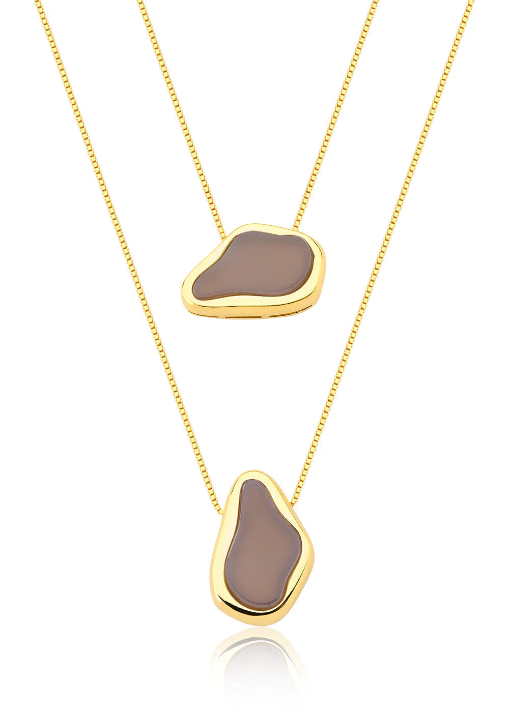 Two gold necklaces with brown pendant stones on a white background