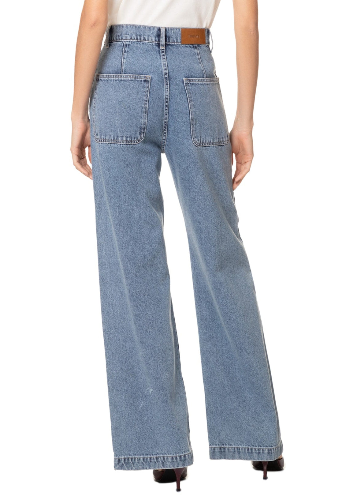 Light blue jeans worn by a person on a white background