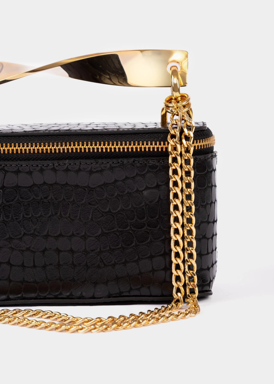 Black handbag with gold chain strap on a white background
