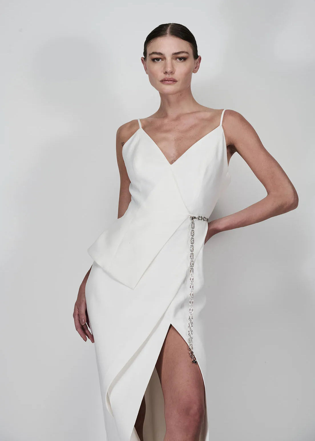 White dress with a slit on a white background