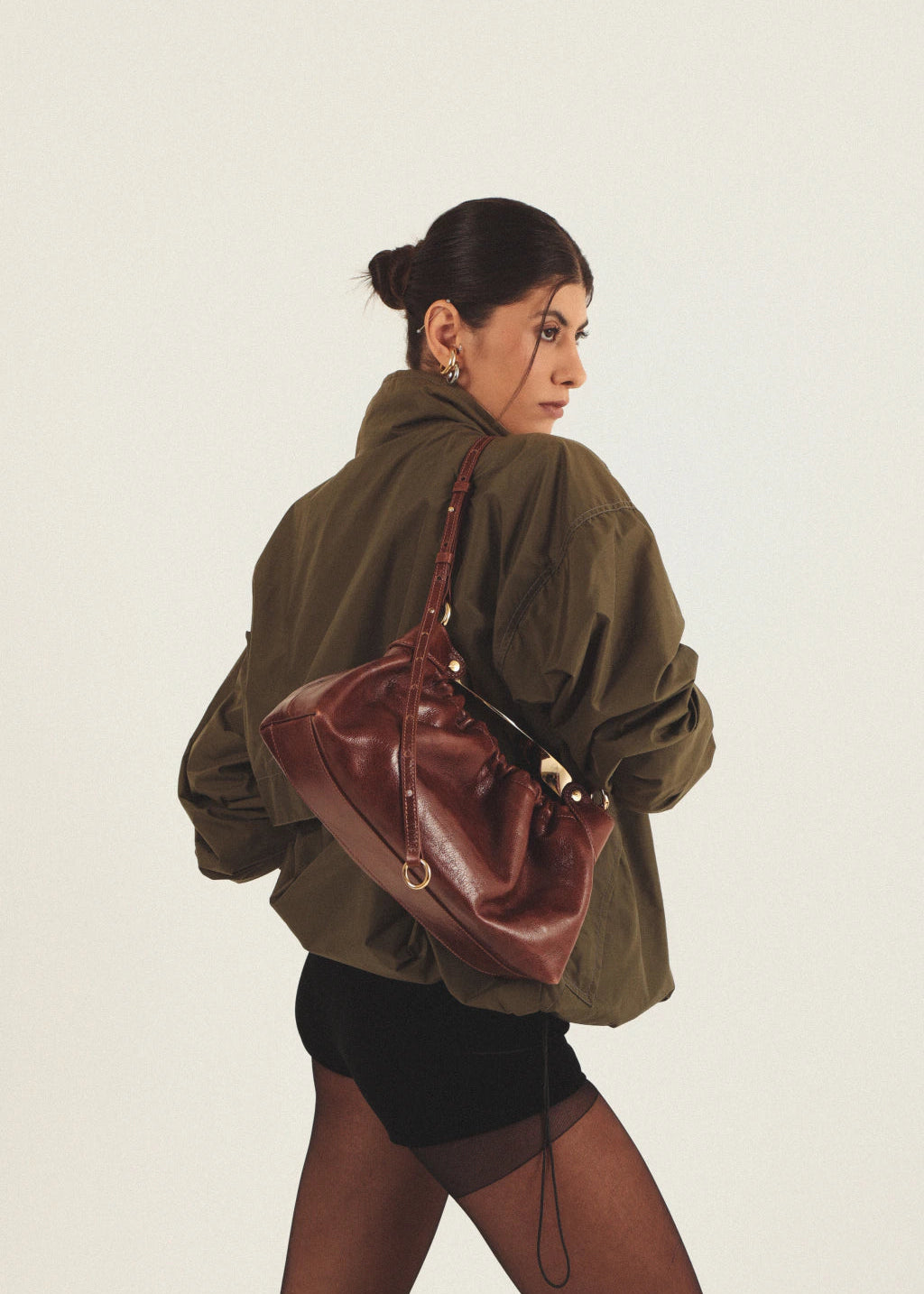 brown leather bag with golden hardware