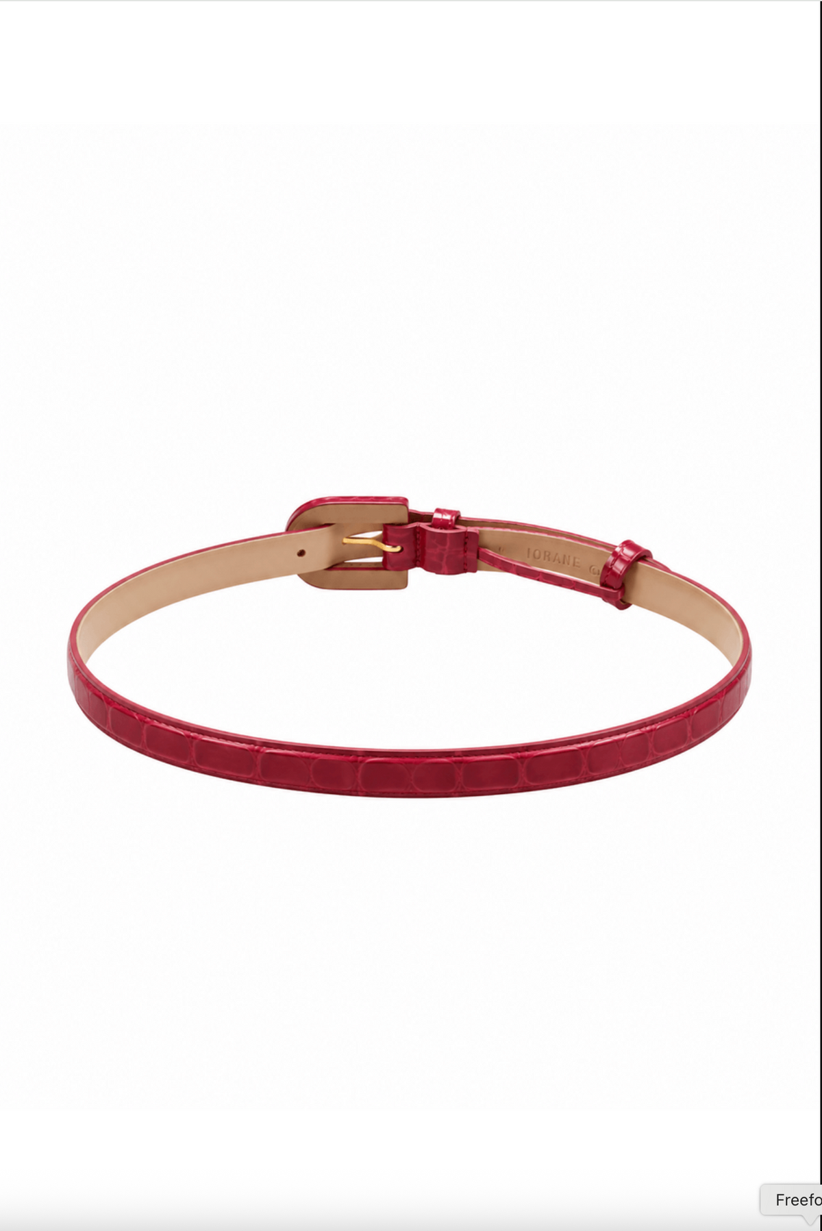 A slim red leather belt with a glossy crocodile-embossed texture, a gold-tone buckle, and a beige interior lining, displayed on a clean white background.