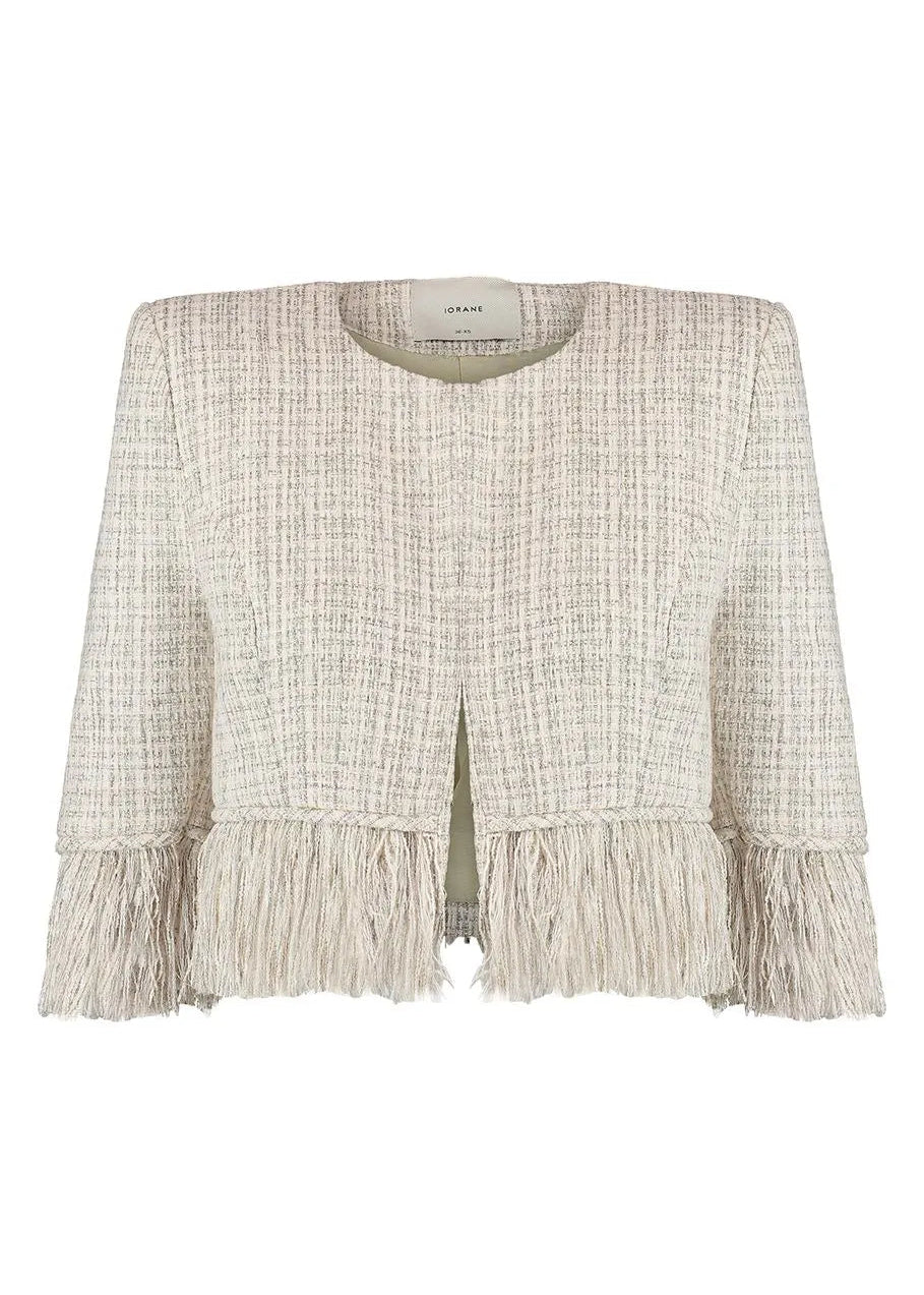 Light-colored textured jacket with ruffled hem on a white background