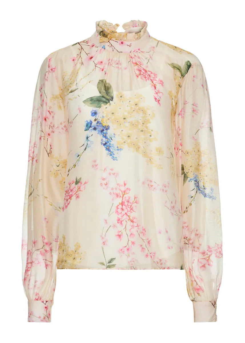 Floral blouse with pastel colors on a white background