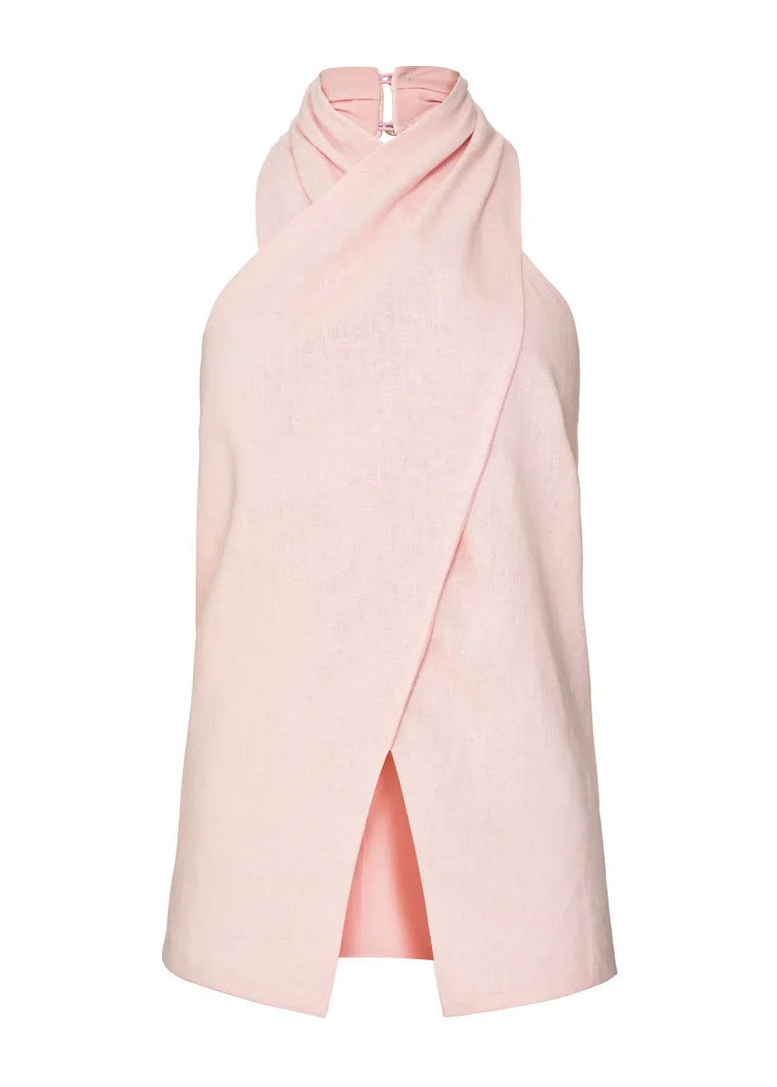 Pink halter neck blouse with a slit on a white background