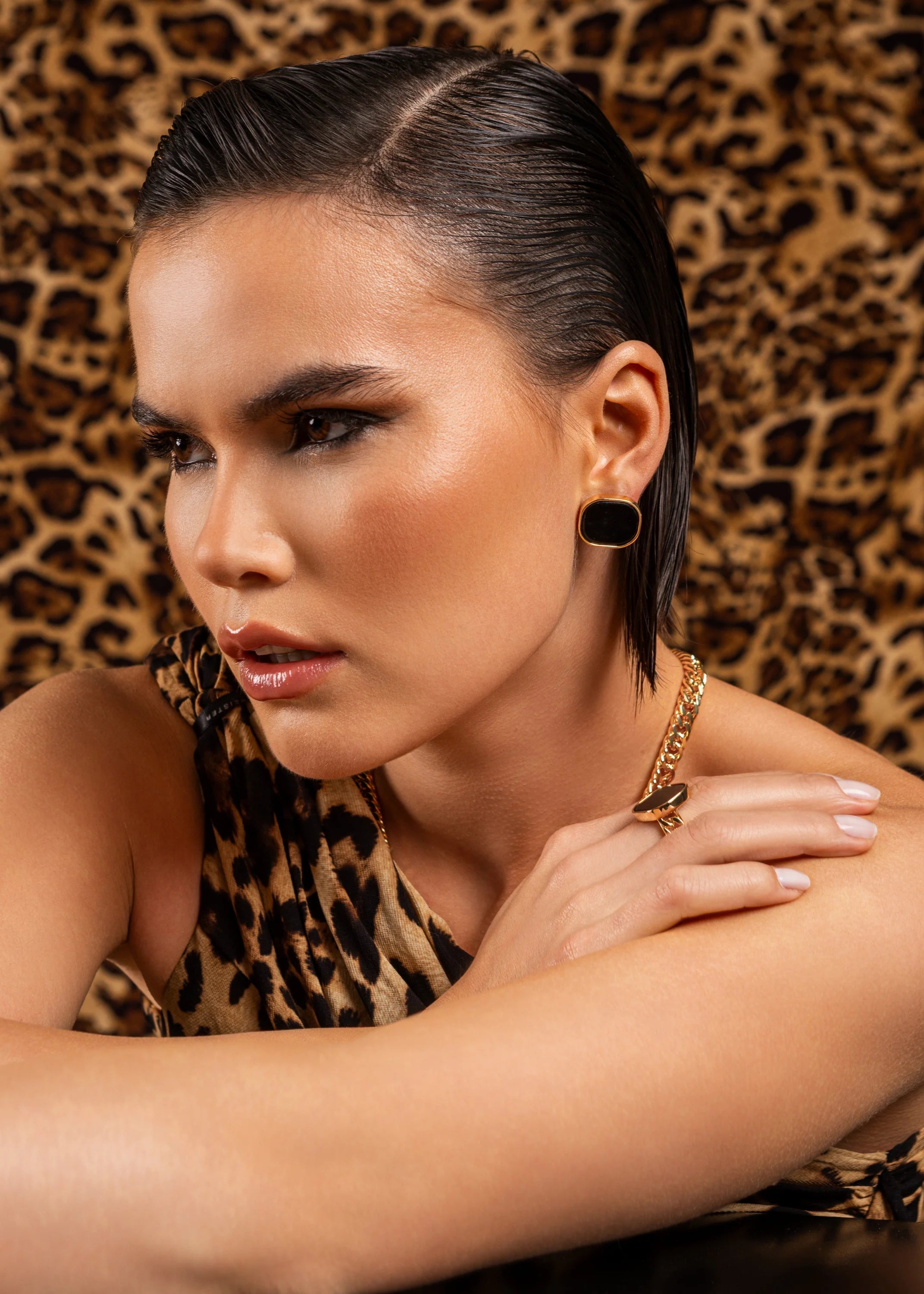 Woman with styled hair against a leopard print background