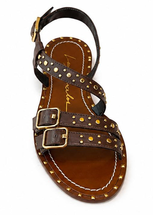 Pair of brown sandals with gold buckles on a white background