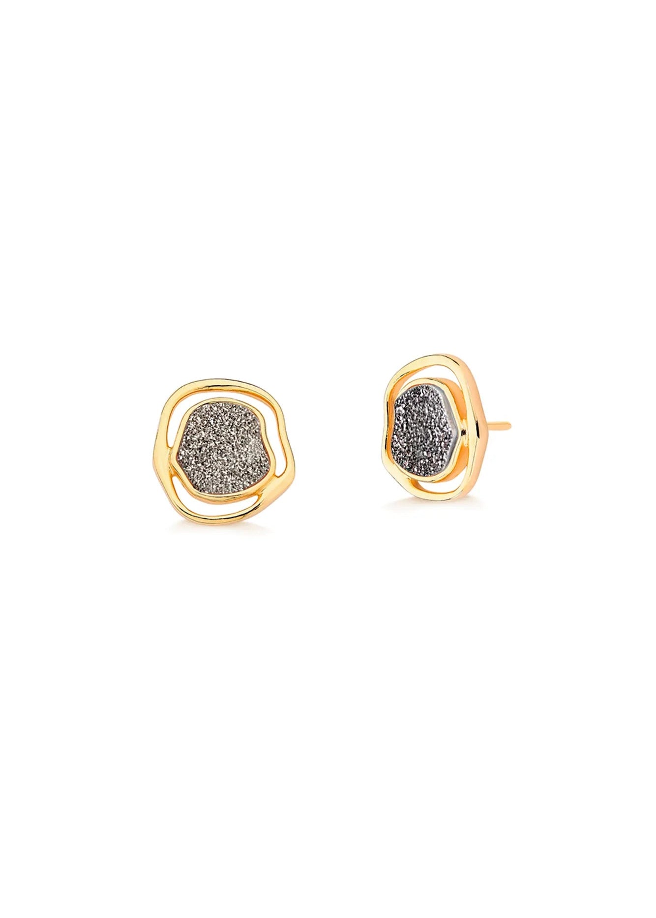 Heart-shaped earrings with gold and silver design on a light gray background