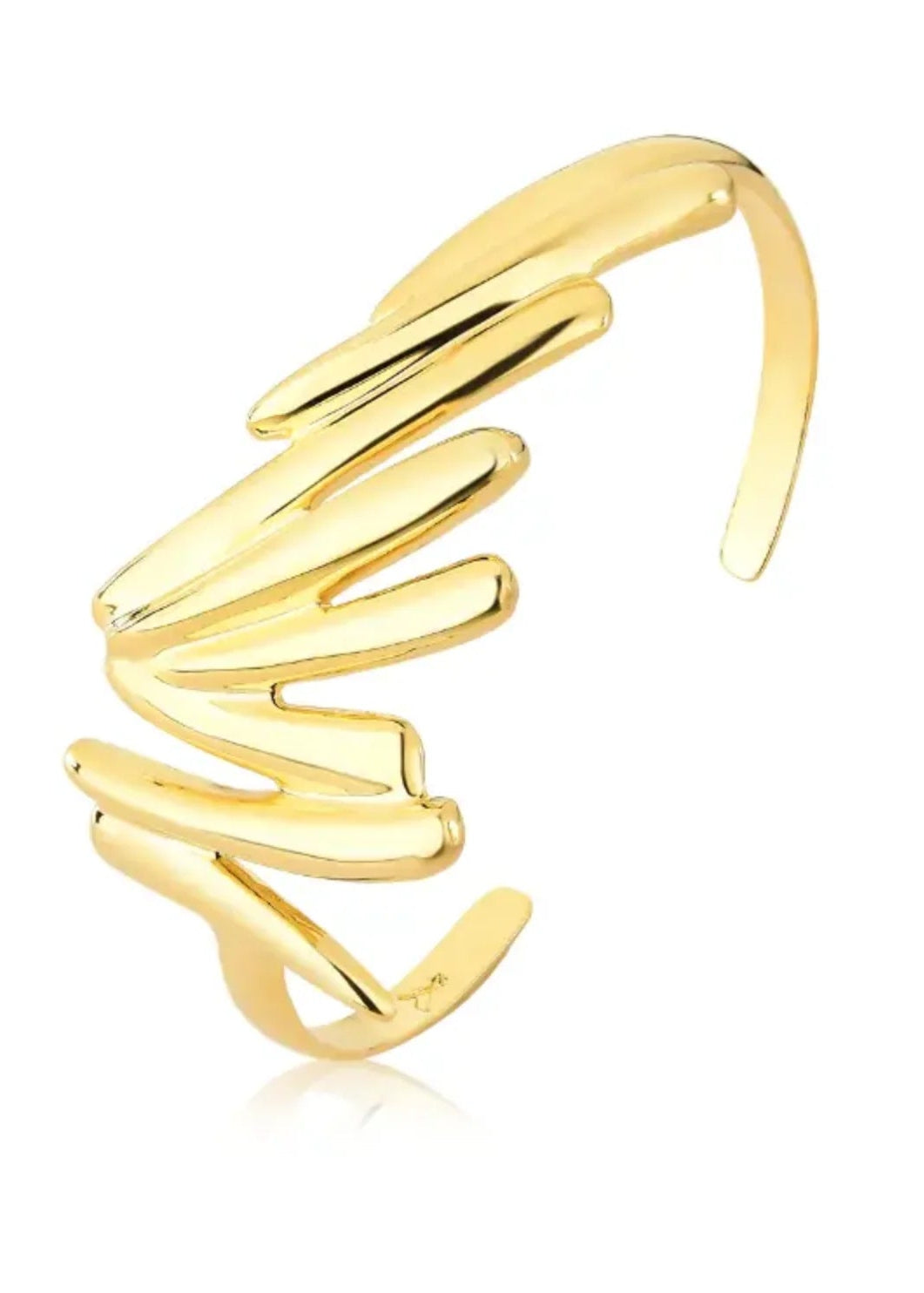 Gold spiral ring on a white background