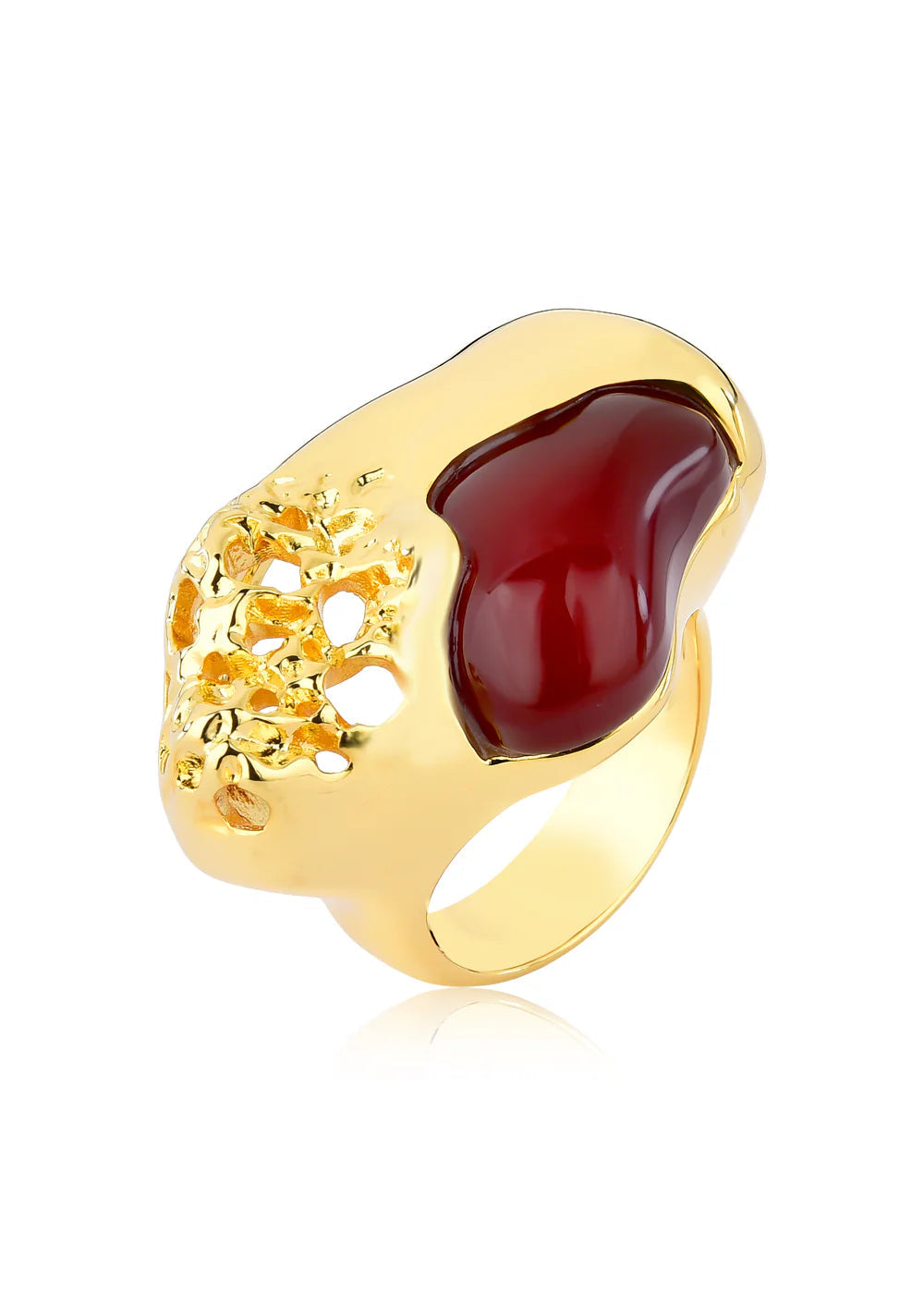 Gold ring with a red stone on a white background
