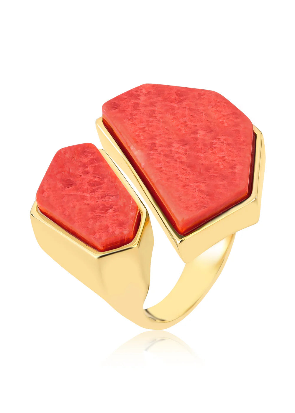 Gold ring with two red coral stones on a white background