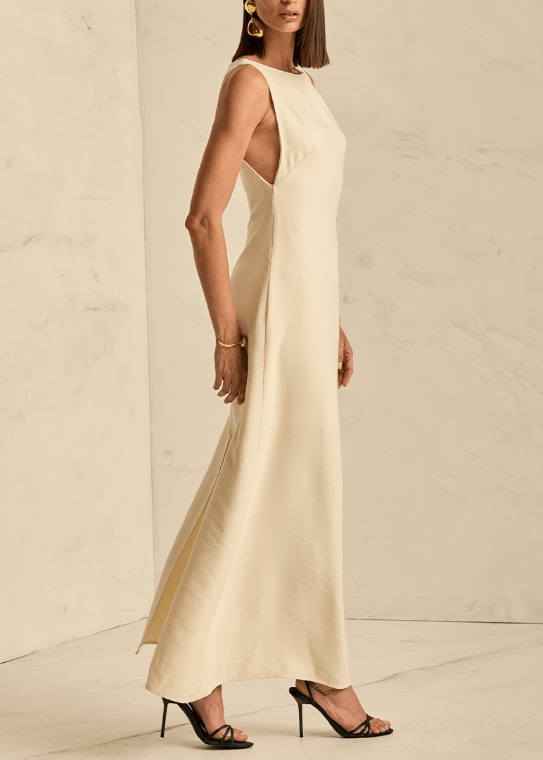 Woman wearing a long beige dress 