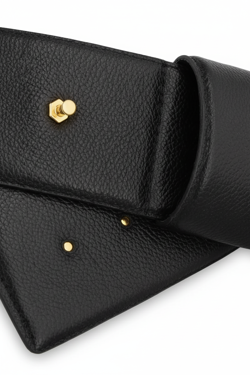 Close-up of a brown pebbled leather clutch or wallet with a gold-tone hexagonal stud closure, shown on a white background.
