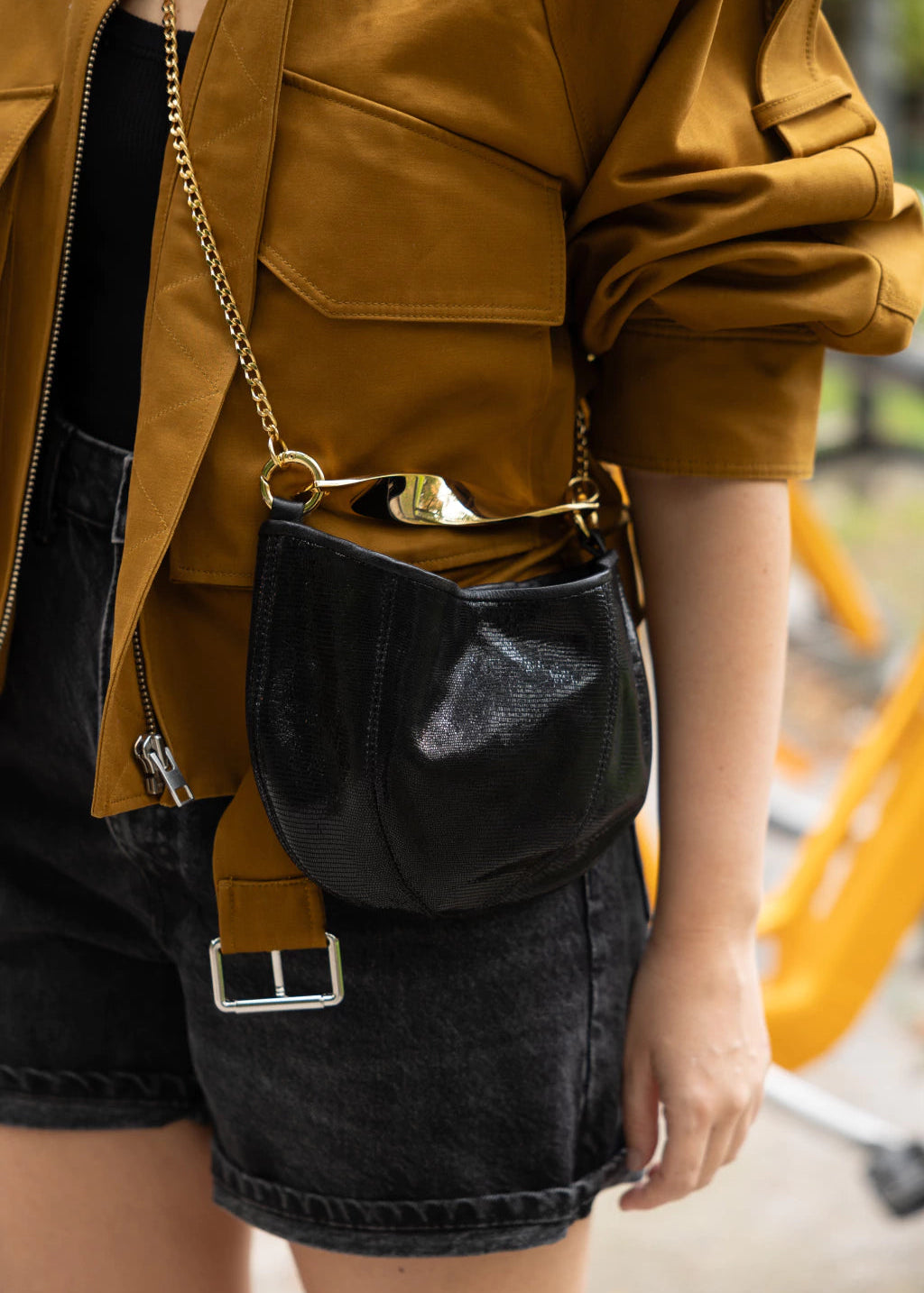black leather bag with golden chain strap