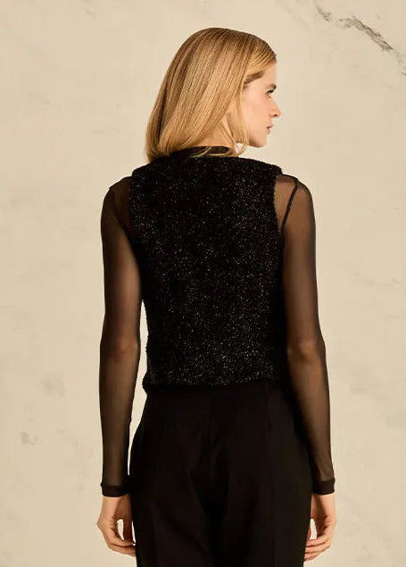 Woman wearing a black vest 